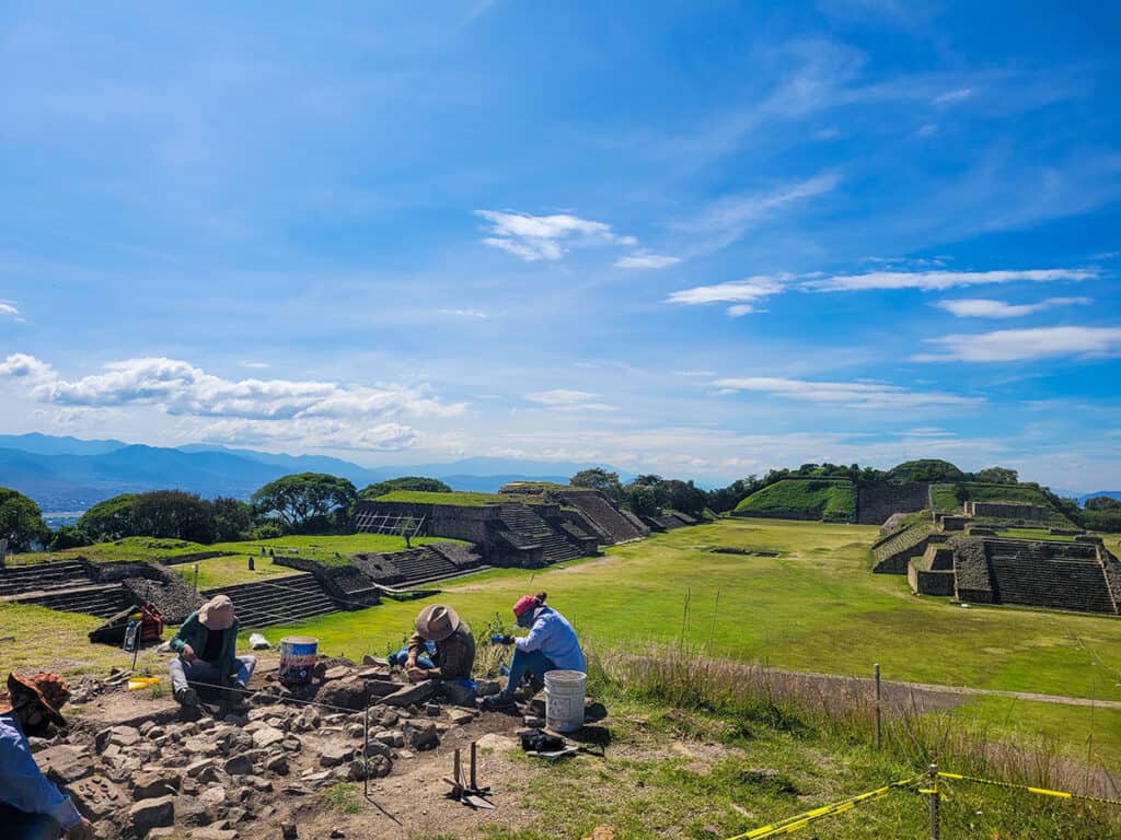 A dig team working on an excavation site at Monte Albán.