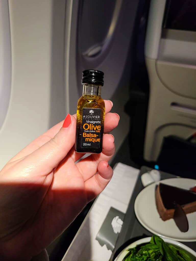A mini bottle of olive oil and balsamic vinegar served with an Aeromexico Business Class meal.