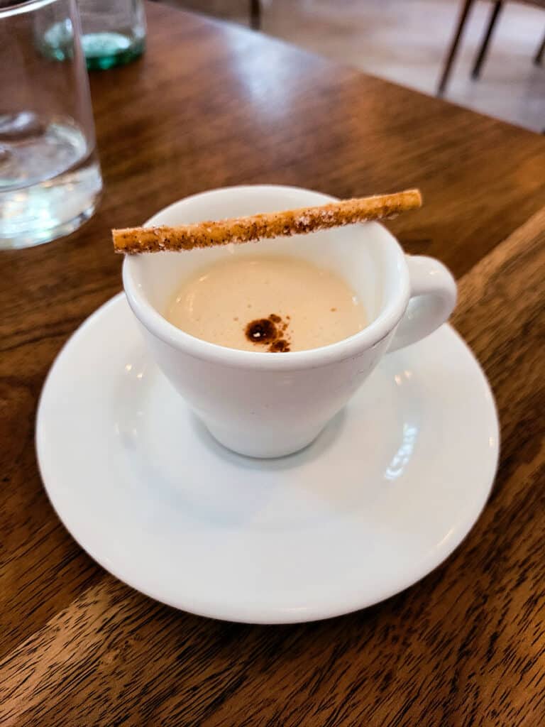 A cold coffee milkshake served as a bonus mini course at Blanco Colima.