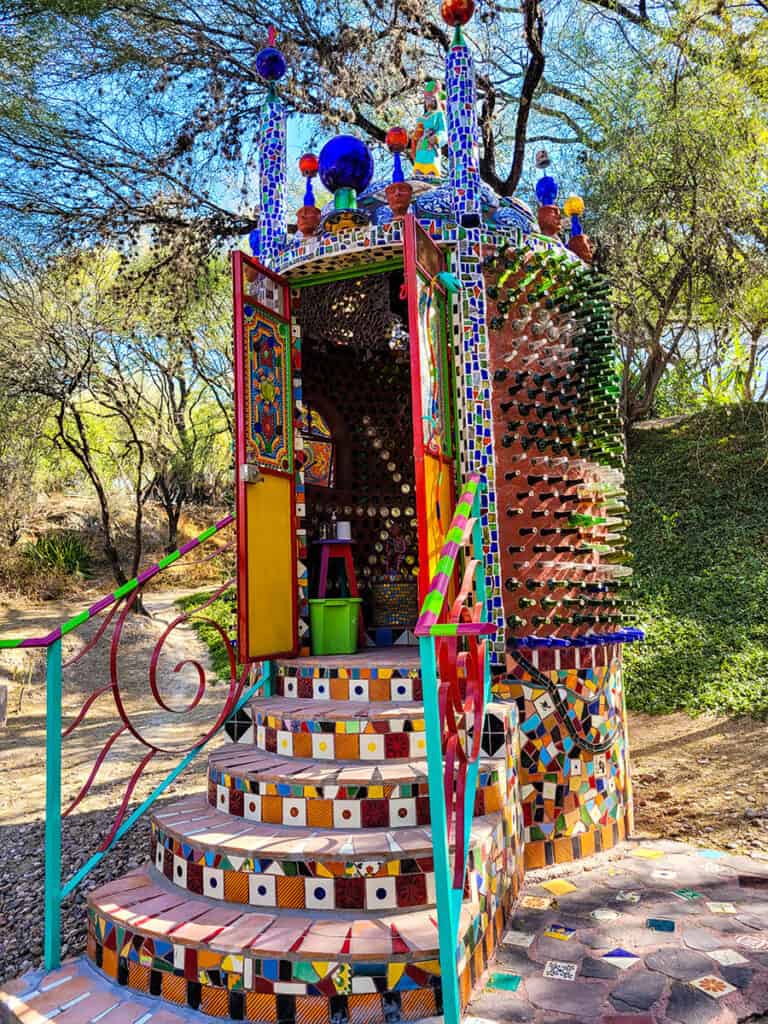 The colourful toilet at the Chapel of Jimmy Ray San Miguel de Allende, covered in bottles and glass tile.